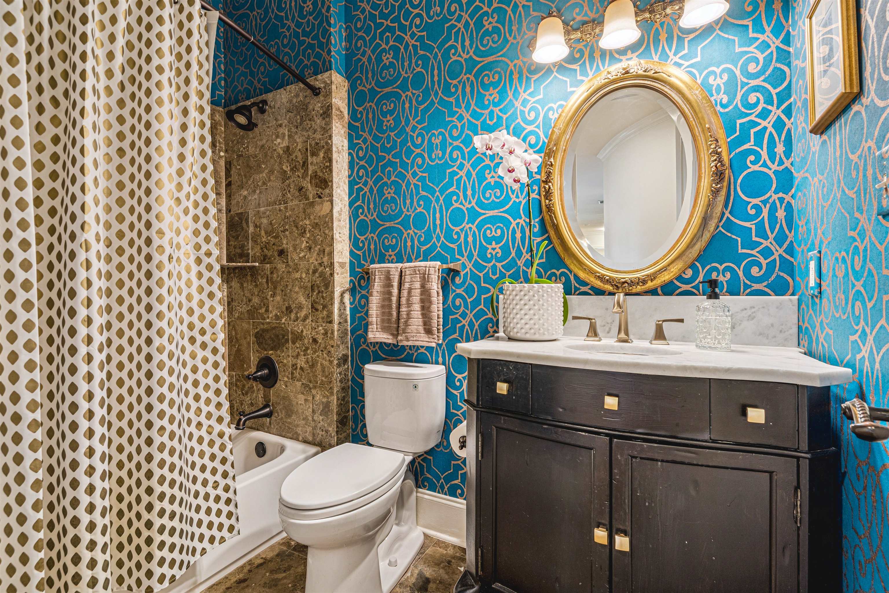 3084 Devonshire Way Germantown, TN 38139 - Photo 21 of 40 Bathroom with vanity, shower / bathtub combination with curtain, and wallpapered walls