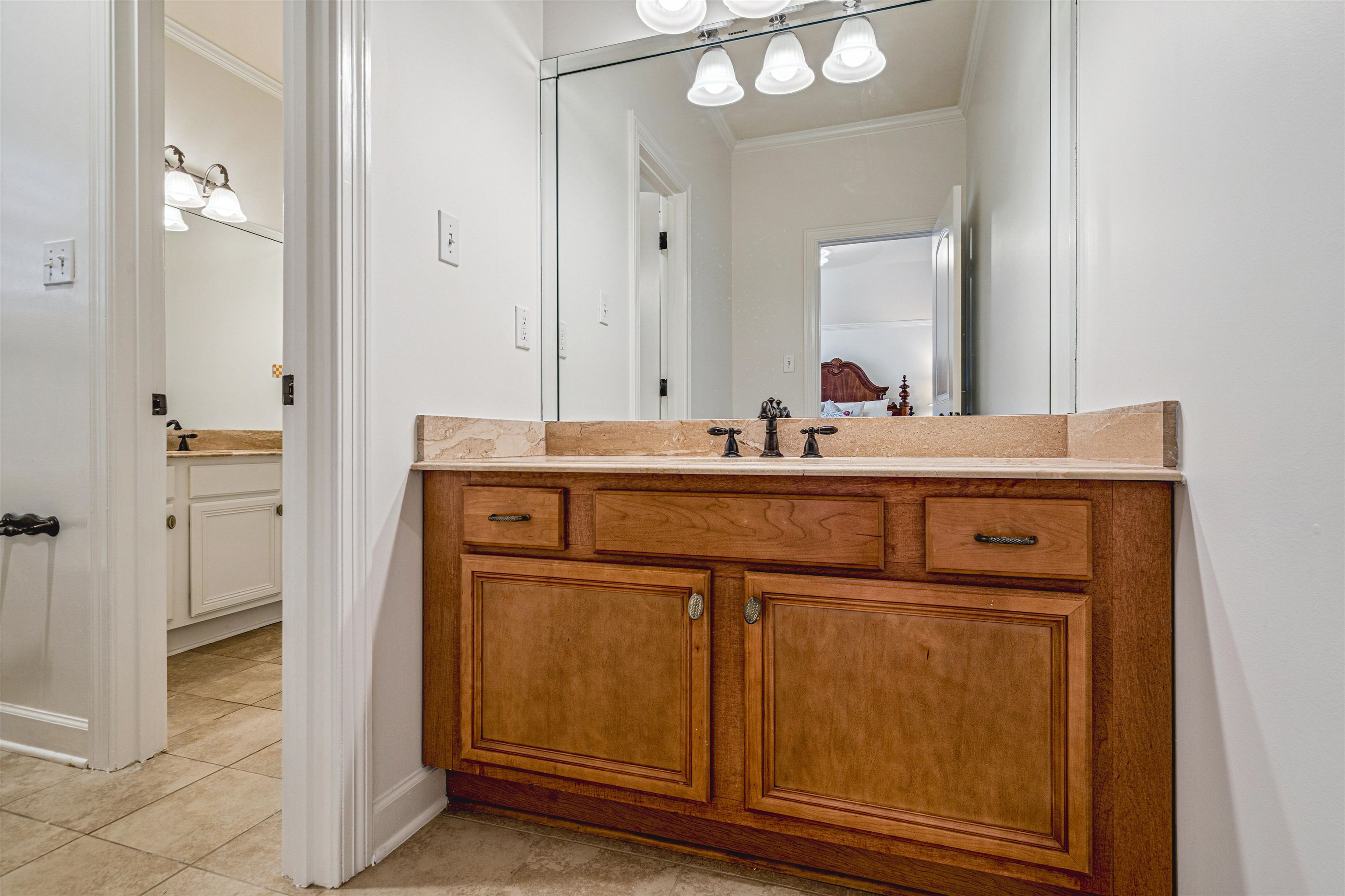 3084 Devonshire Way Germantown, TN 38139 - Photo 29 of 40 Bathroom featuring vanity, ornamental molding, light tile patterned floors, and ensuite bathroom