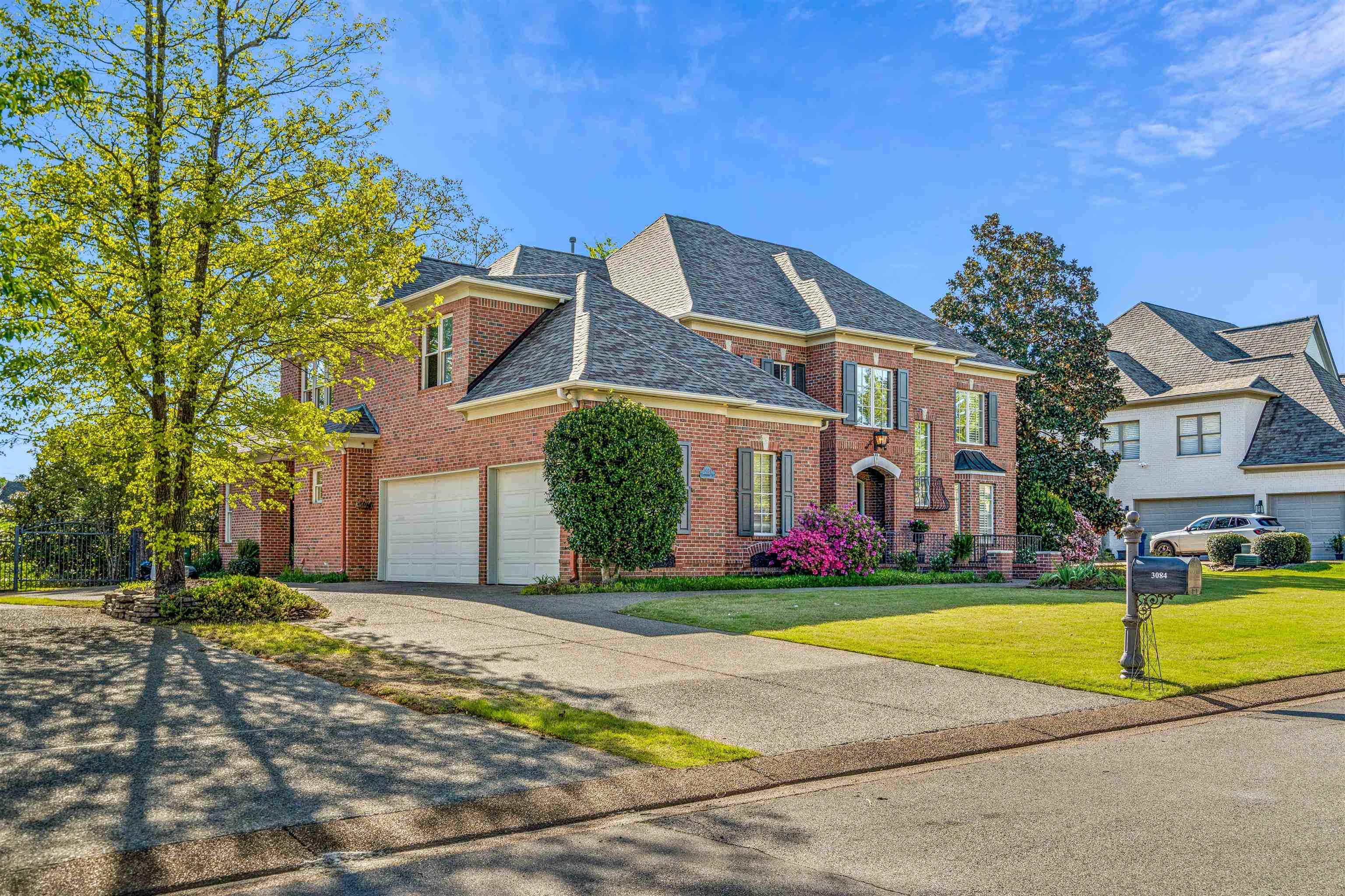 3084 Devonshire Way Germantown, TN 38139 - Photo 37 of 40 View of front facade featuring brick siding, concrete driveway, a shingled roof, and a front yard