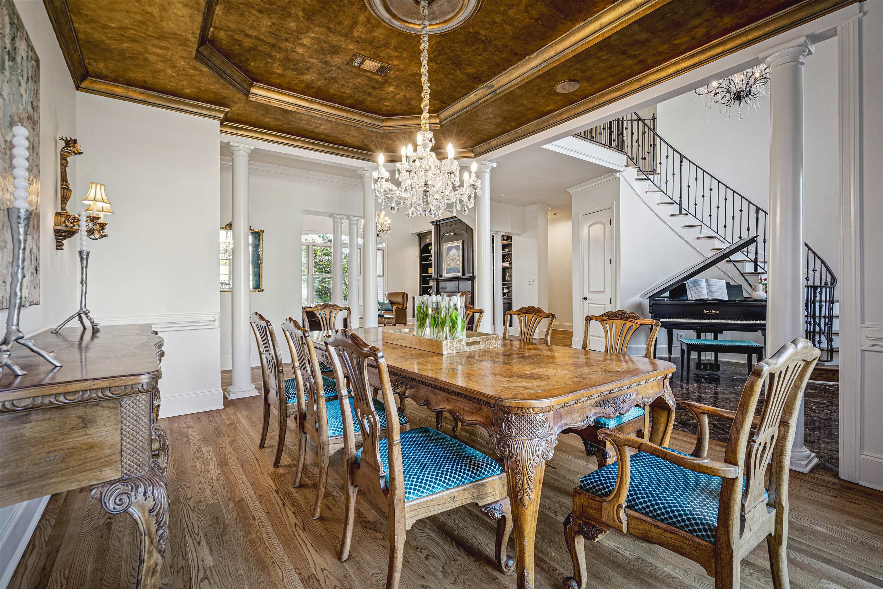 3084 Devonshire Way Germantown, TN 38139 - Photo 5 of 40 Dining room featuring a tray ceiling, a chandelier, ornate columns, crown molding, and wood finished floors