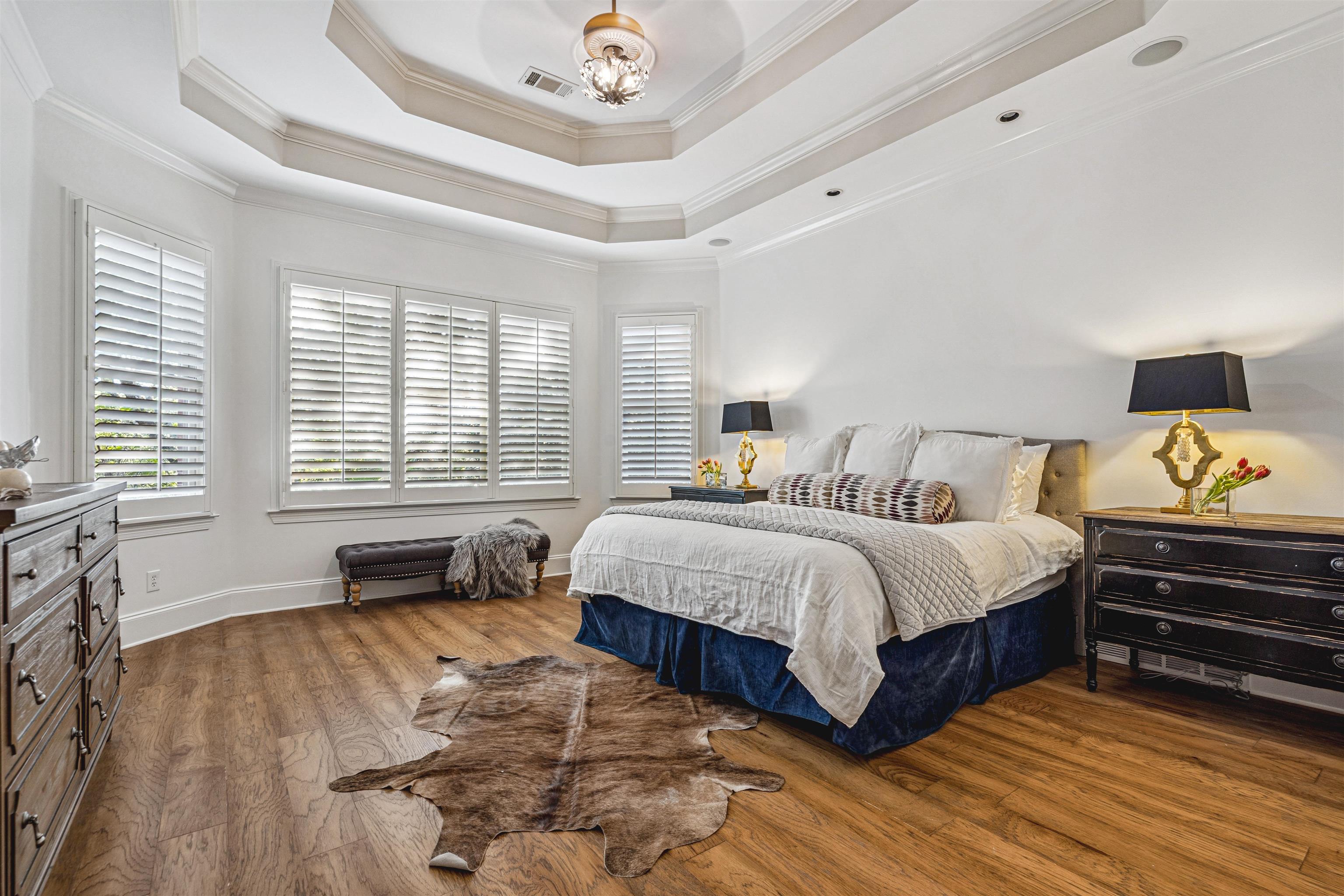 3084 Devonshire Way Germantown, TN 38139 - Photo 10 of 40 Bedroom with dark wood-style floors, ornamental molding, and a raised ceiling