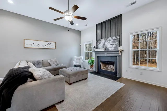 a living room with furniture and a fireplace