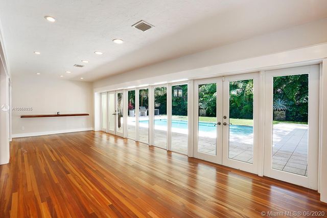 a view of an entryway with wooden floor