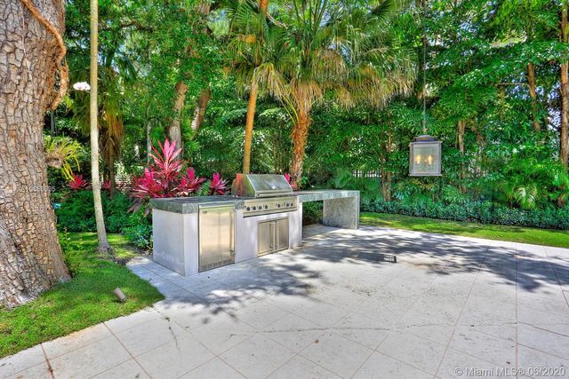 a utility room with yard barbeque oven and outdoor seating