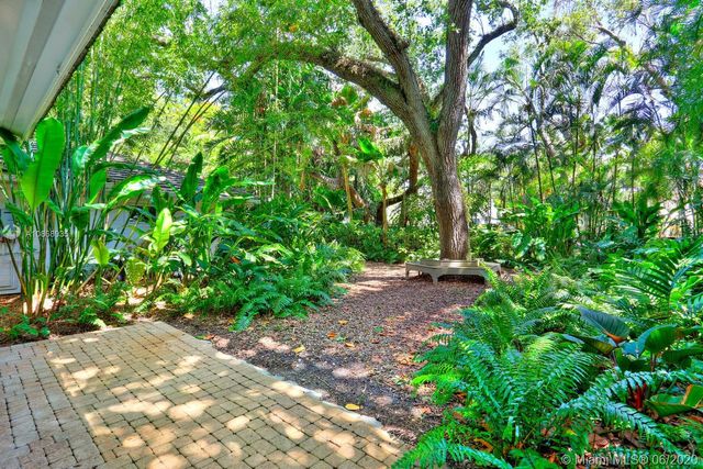 a view of backyard with green space
