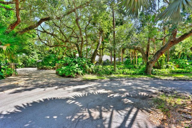 a view of a street with a trees