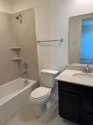 a bathroom with a sink a toilet and a bathtub