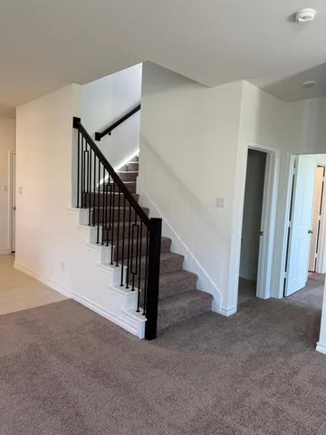 a view of a hallway with staircase