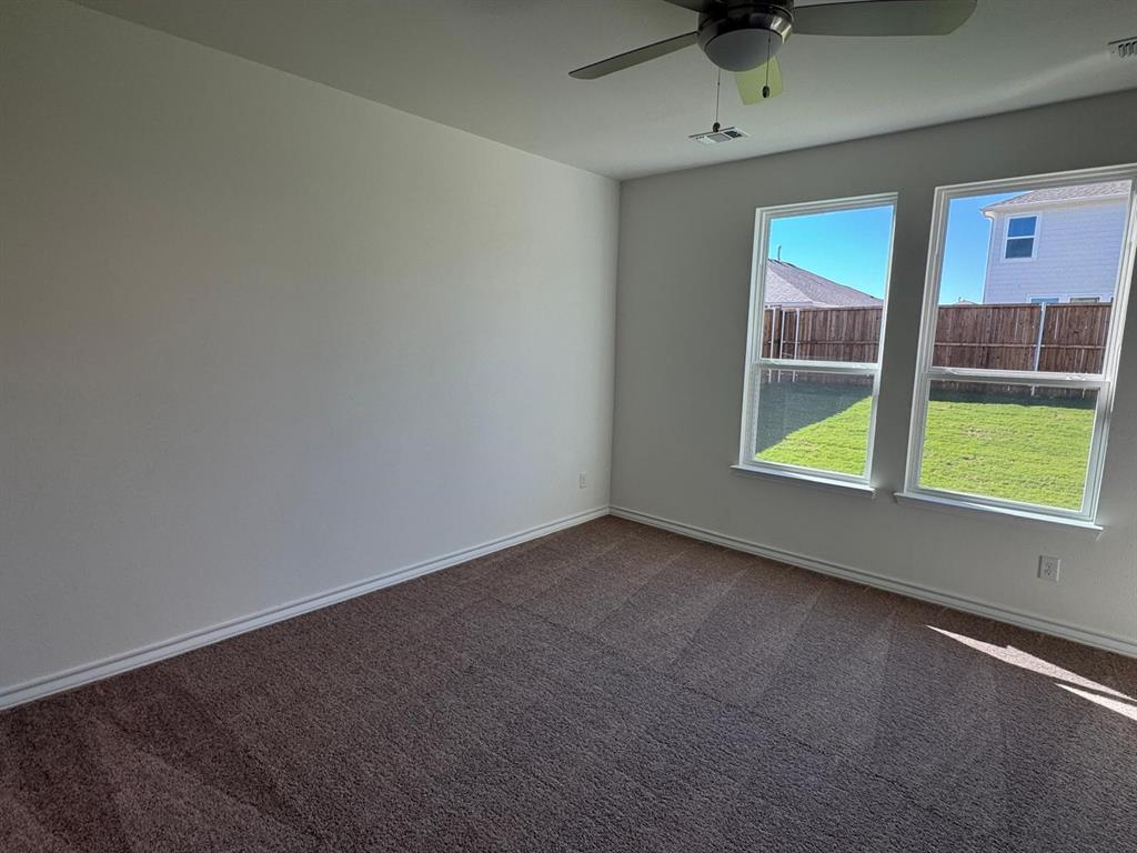 764 Windsor Drive Princeton, TX 75407 - Photo 7 of 18 a view of an empty room with a window