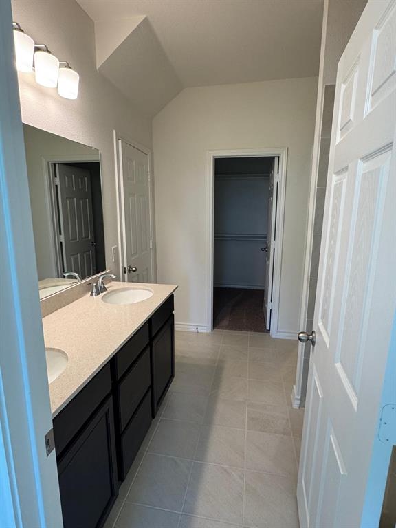 764 Windsor Drive Princeton, TX 75407 - Photo 8 of 18 a bathroom with a double vanity sink a and a mirror