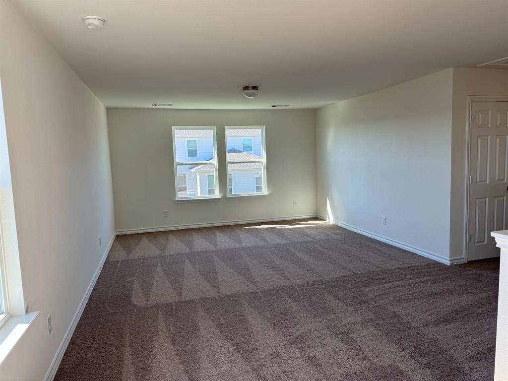 764 Windsor Drive Princeton, TX 75407 - Photo 10 of 18 an empty room with windows