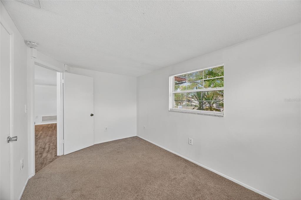 10102 Glen Moor Lane Port Richey, FL 34668 - Photo 22 of 49 an empty room with windows