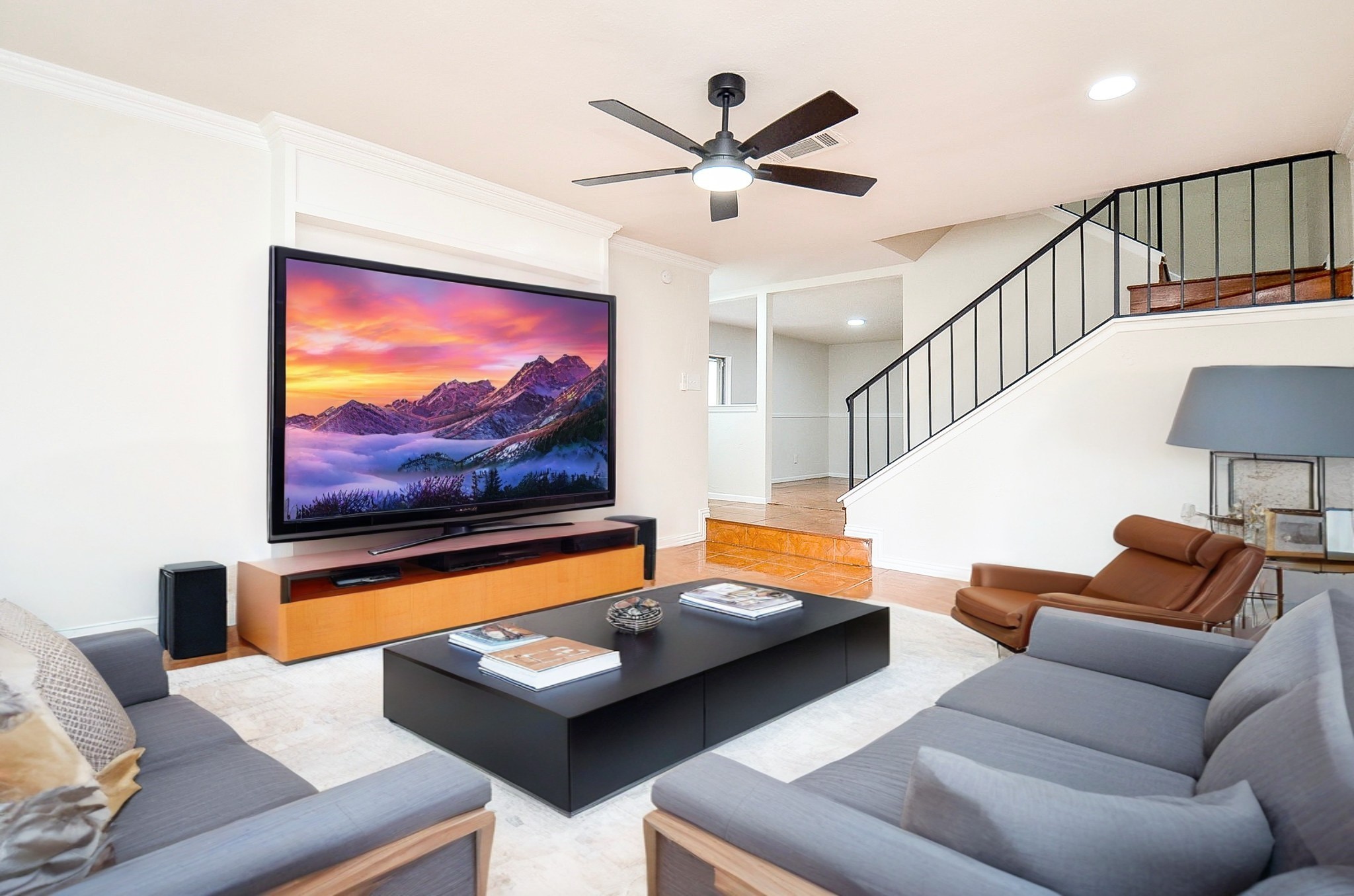 a living room with furniture and a flat screen tv