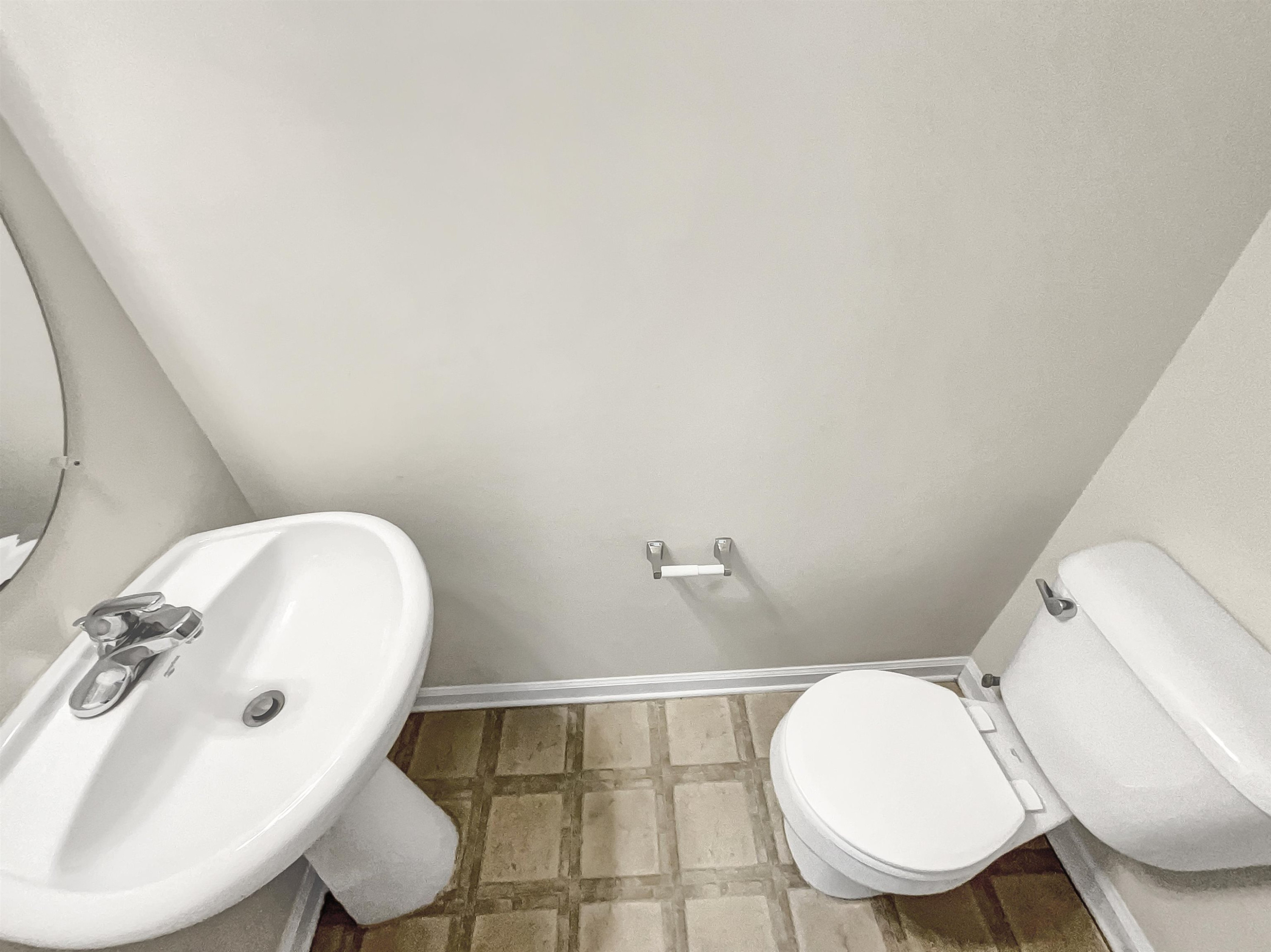 11720 Coppergate Drive, Unit 109 Raleigh, NC 27614 - Photo 6 of 16 a bathroom with a toilet sink a mirror and vanity