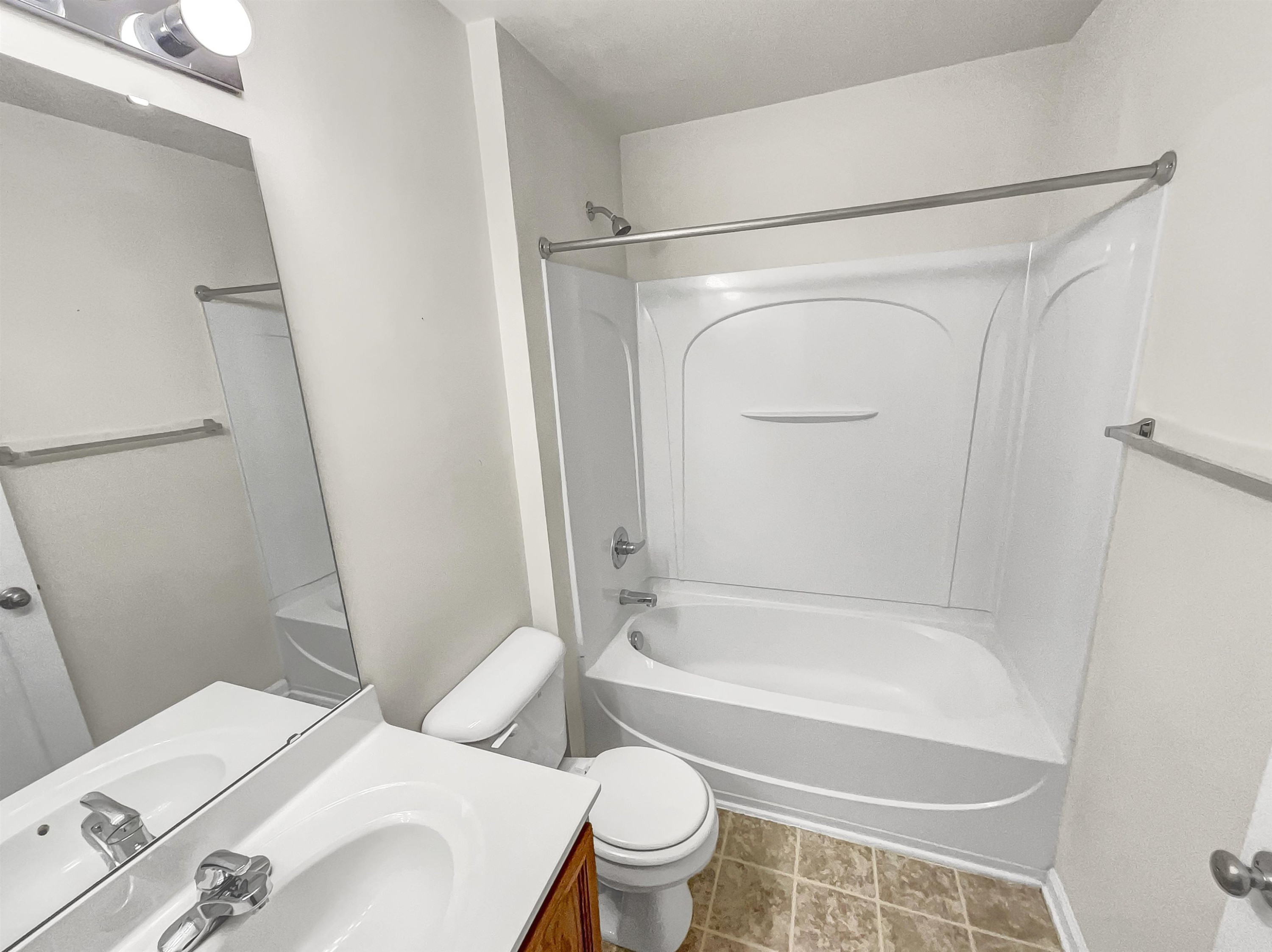 11720 Coppergate Drive, Unit 109 Raleigh, NC 27614 - Photo 7 of 16 a bathroom with a sink toilet and shower