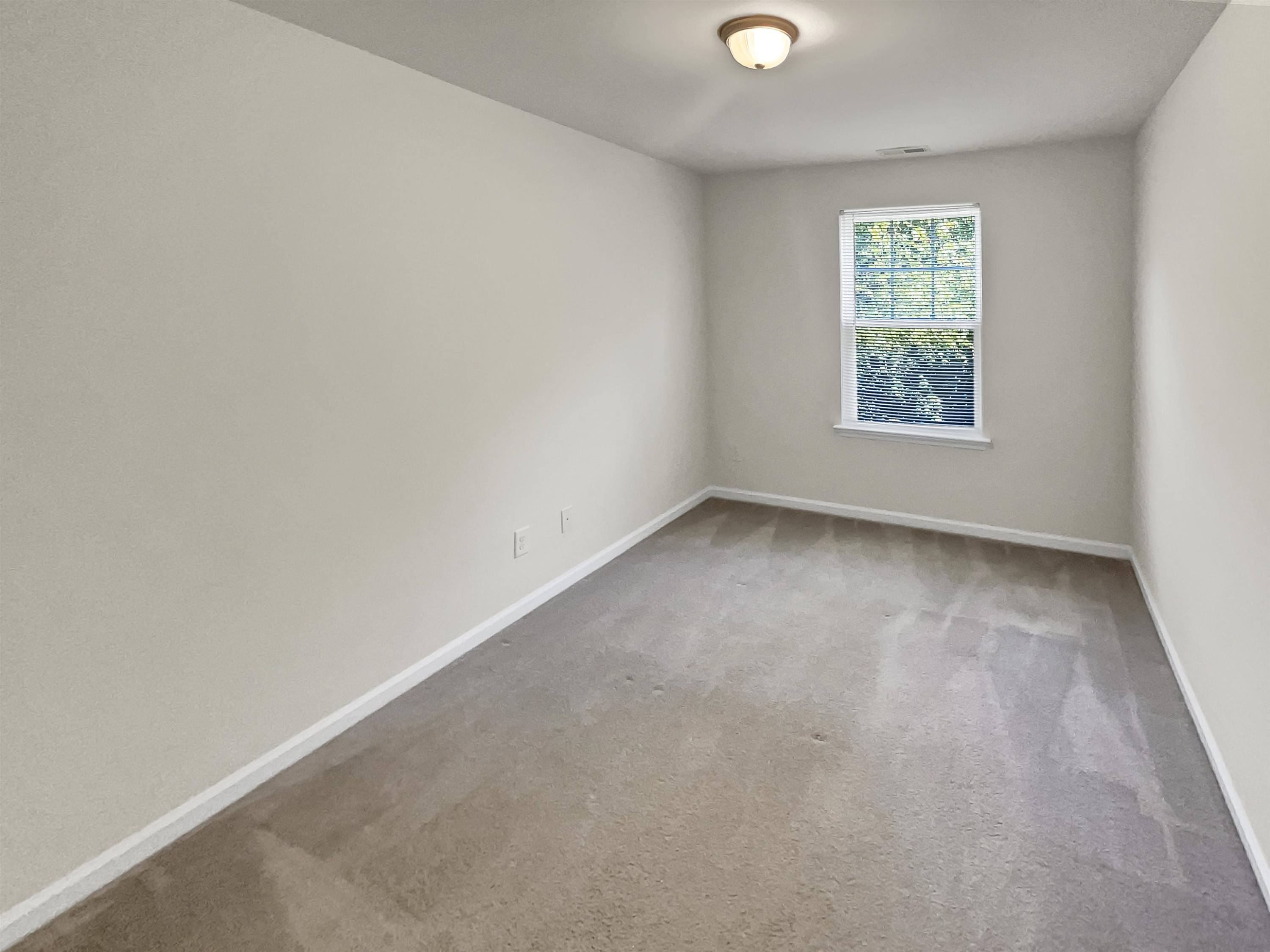 11720 Coppergate Drive, Unit 109 Raleigh, NC 27614 - Photo 9 of 16 an empty room with a window