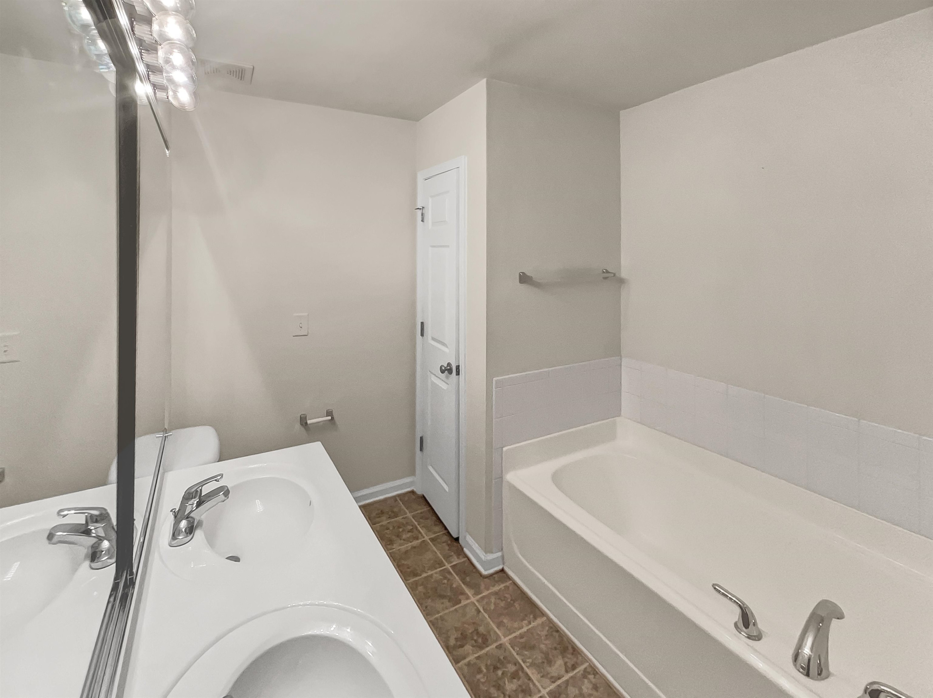 11720 Coppergate Drive, Unit 109 Raleigh, NC 27614 - Photo 10 of 16 a bathroom with a bathtub and a shower