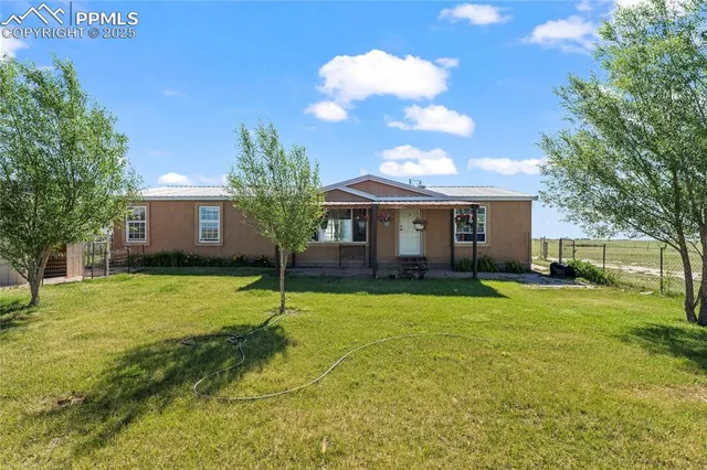a house view with a garden space