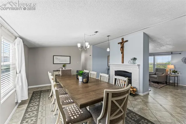 a dining room with furniture and window