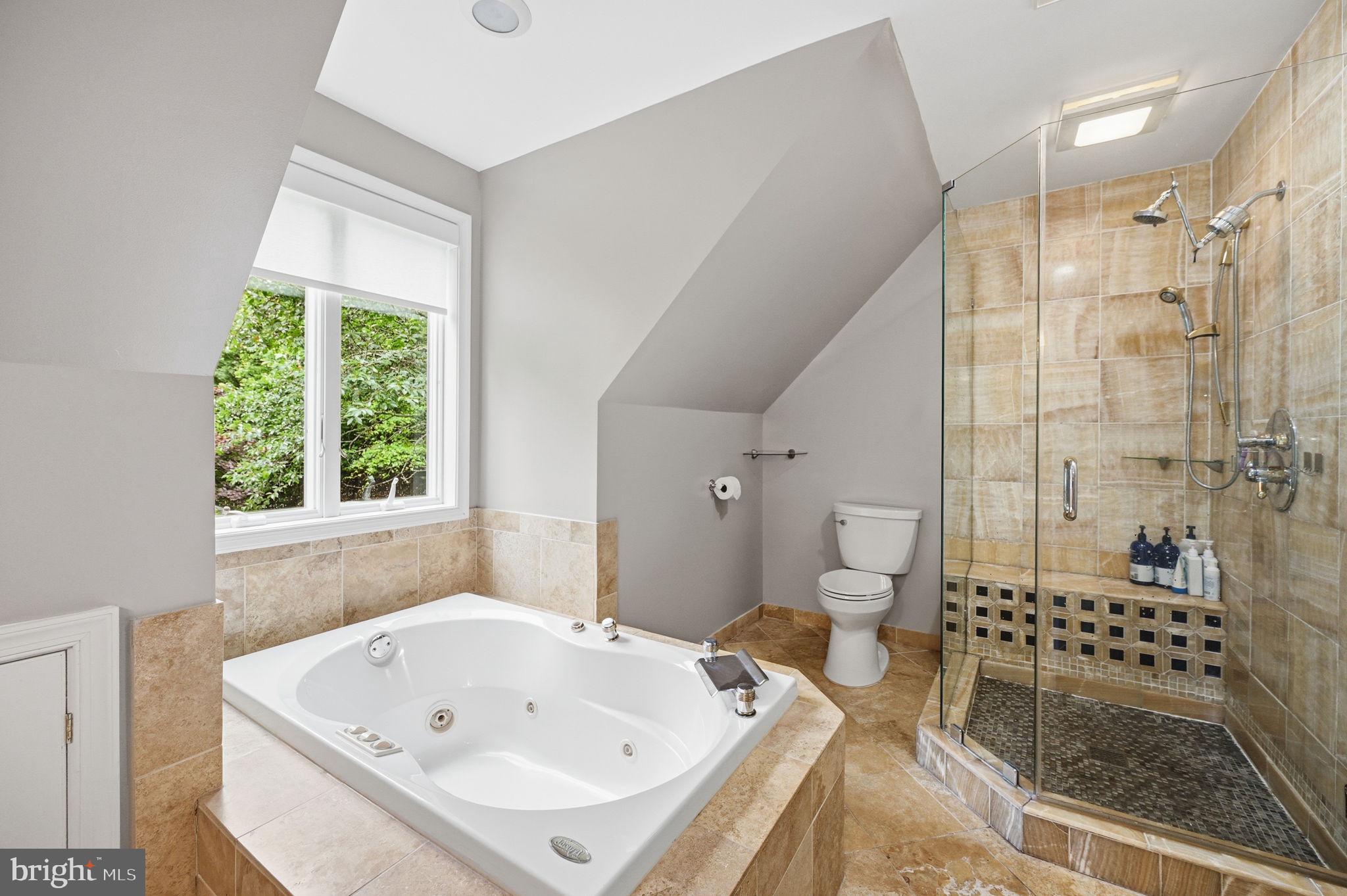 2506 Pinoak Lane Reston, VA 20191 - Photo 17 of 33 a bathroom with a bathtub and a shower