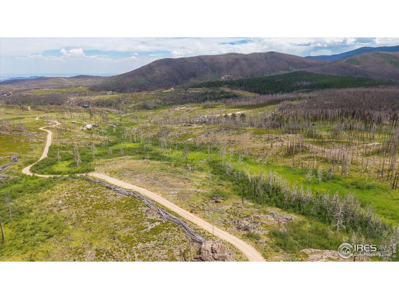 529 Quartz Road Bellvue, CO 80512 - Photo 21 of 31 a view of an aerial view of residential houses with outdoor space and mountain view