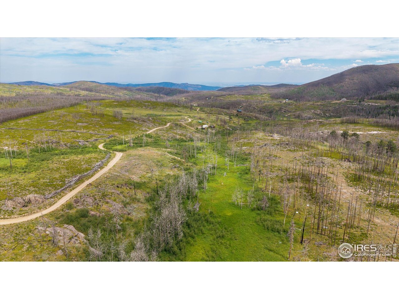 529 Quartz Road Bellvue, CO 80512 - Photo 23 of 31 a view of an aerial view of residential houses with outdoor space and ocean view
