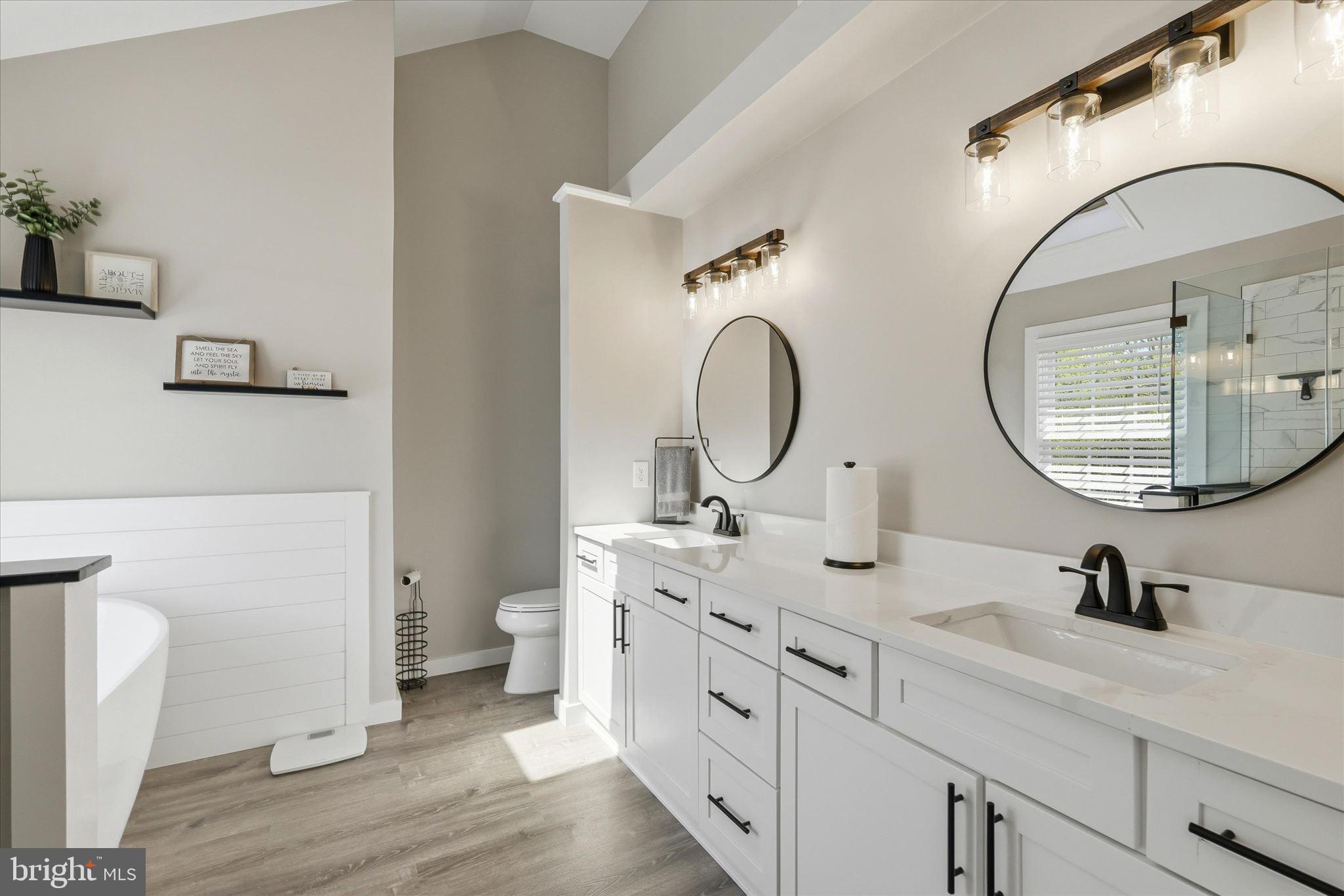 176 Warren Grove Road Barnegat, NJ 08005 - Photo 42 of 71 a bathroom with a granite countertop toilet a sink and a mirror