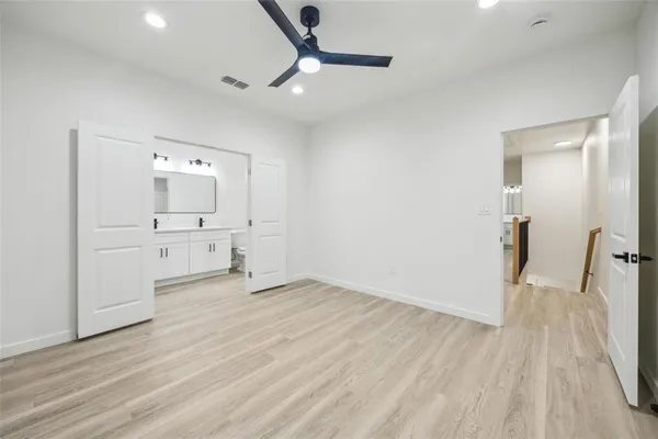 a bathroom with a double vanity sink mirror and shower