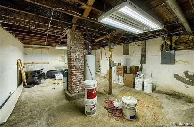 a view of a storage room with water heater and racks