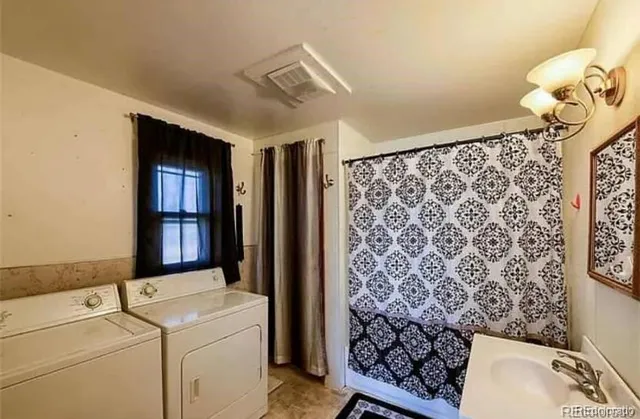 a utility room with dryer and washer