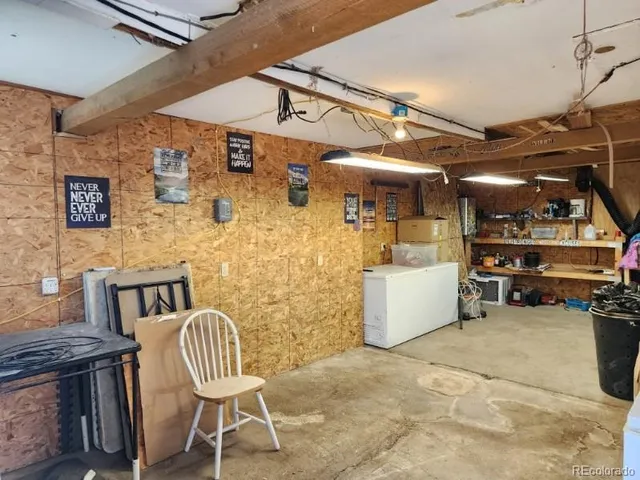 a view of a patio with table and chairs