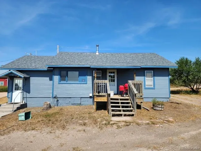 a front view of a house with basketball court