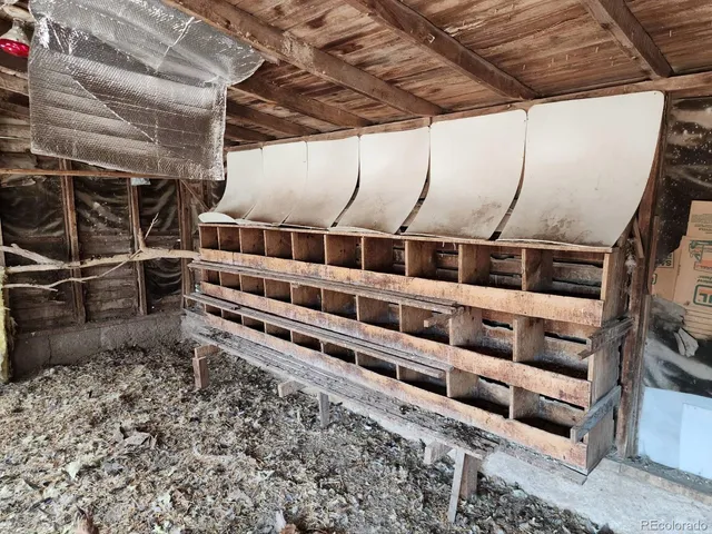a view of an empty room with wooden walls