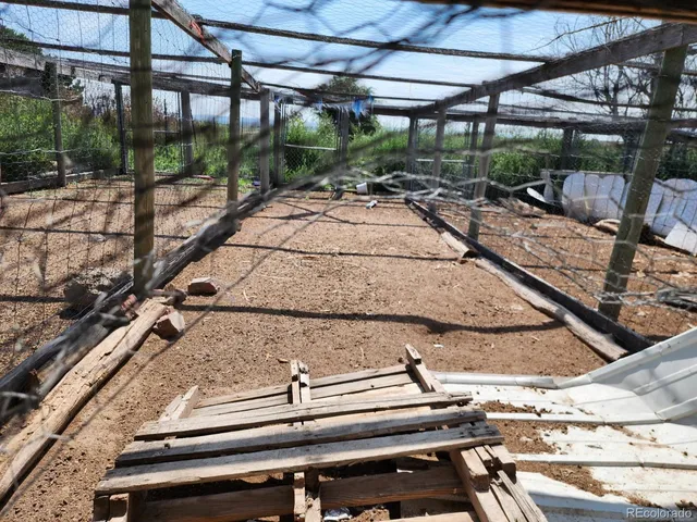 a view of a backyard with sitting area