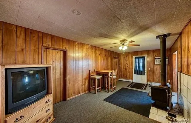 a view of an empty room with a fireplace