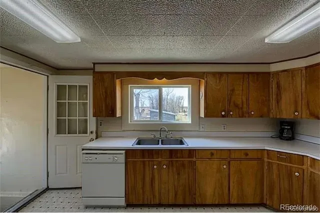 a kitchen with sink and window