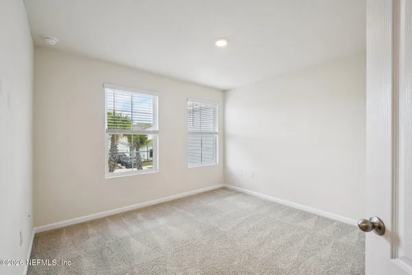 an empty room with windows