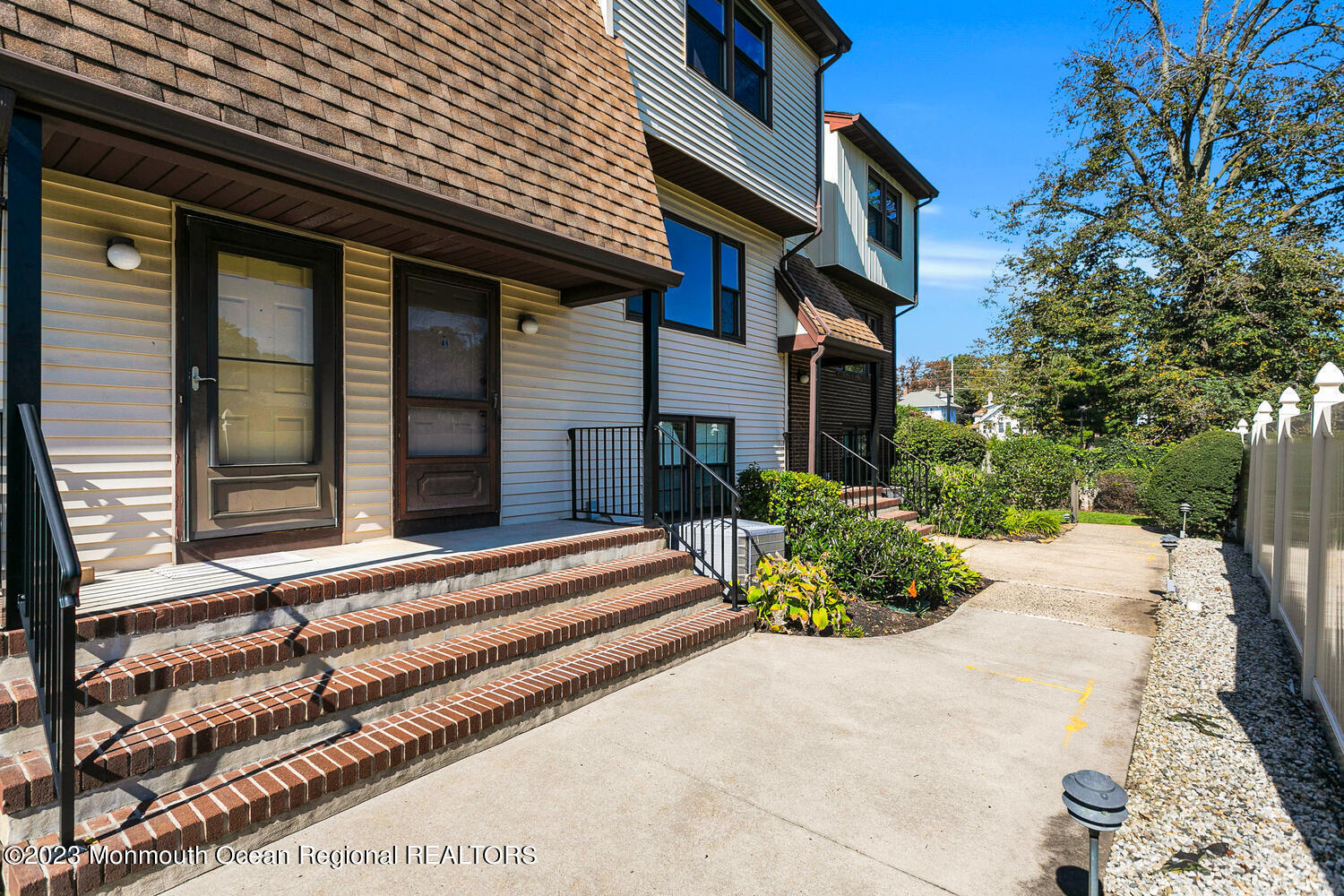 20 Pinckney Road, Unit B6 Red Bank, NJ 07701 - Photo 3 of 25 a front view of a house with a yard