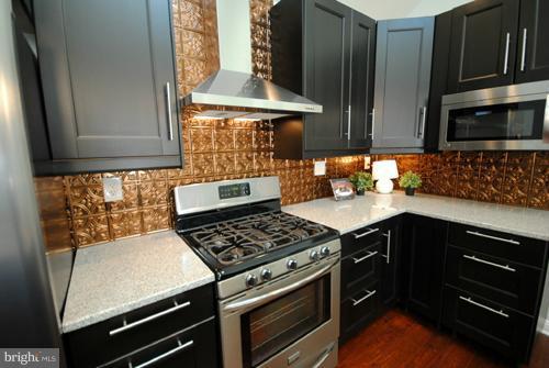 1115 Haverhill Road Baltimore, MD 21229 - Photo 7 of 30 Gourmet Kitchen with Tin Backsplash