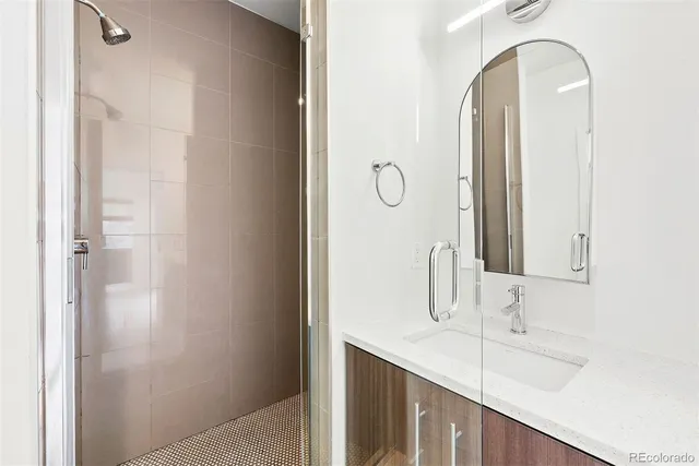 a bathroom with a double vanity sink and a mirror