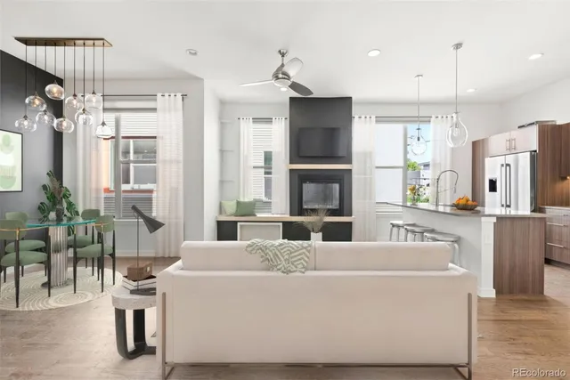 a living room with kitchen island furniture and a flat screen tv