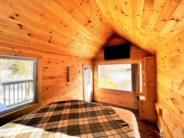 a view of a patio with wooden fence