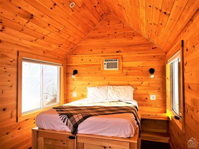 a view of a door and wooden floor