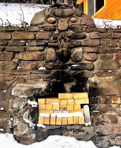 a view of a house with wooden deck