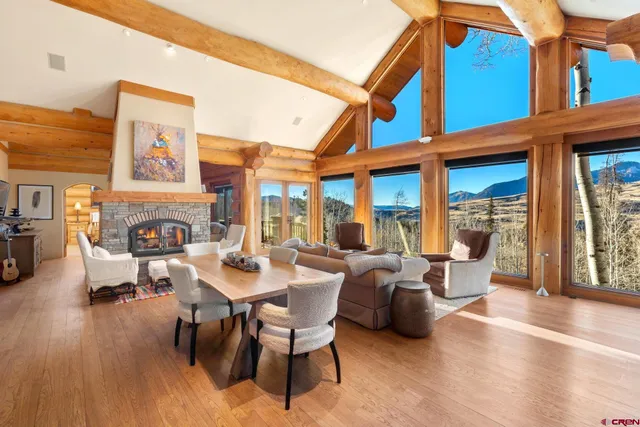 a view of a patio with dining table and chairs