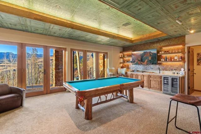 a room with furniture and pool table