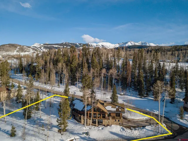 a view of a swimming pool with a patio and a yard
