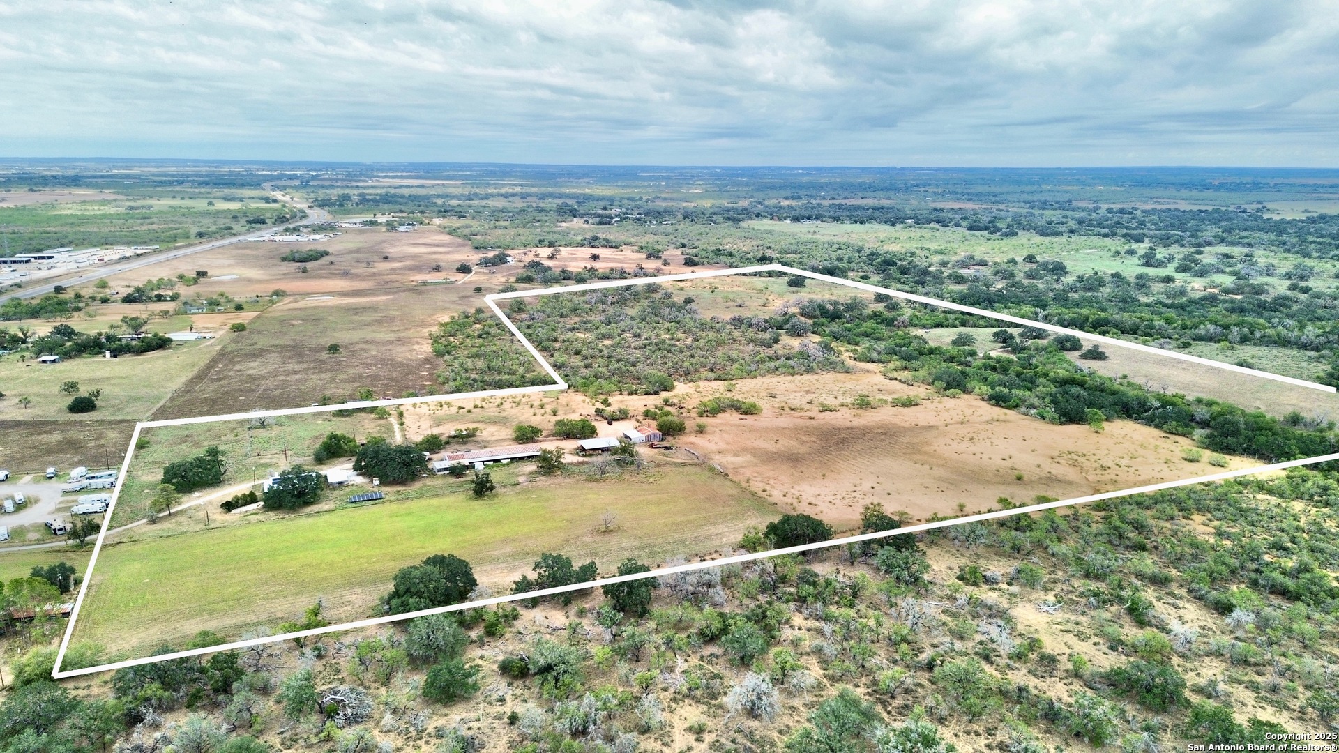 2880 2nd Street Pleasanton, TX 78064 - Photo 31 of 32 an aerial view of residential houses with outdoor space