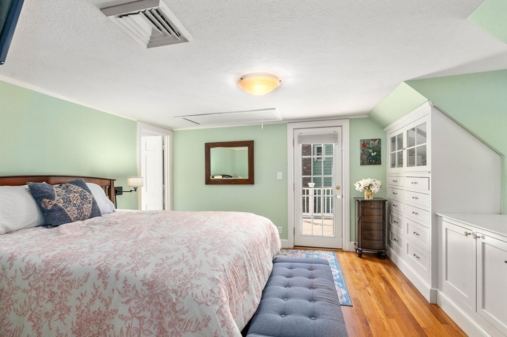 32 Verndale Road Newton, MA 02461 - Photo 13 of 33 a bedroom with a large bed and a chandelier