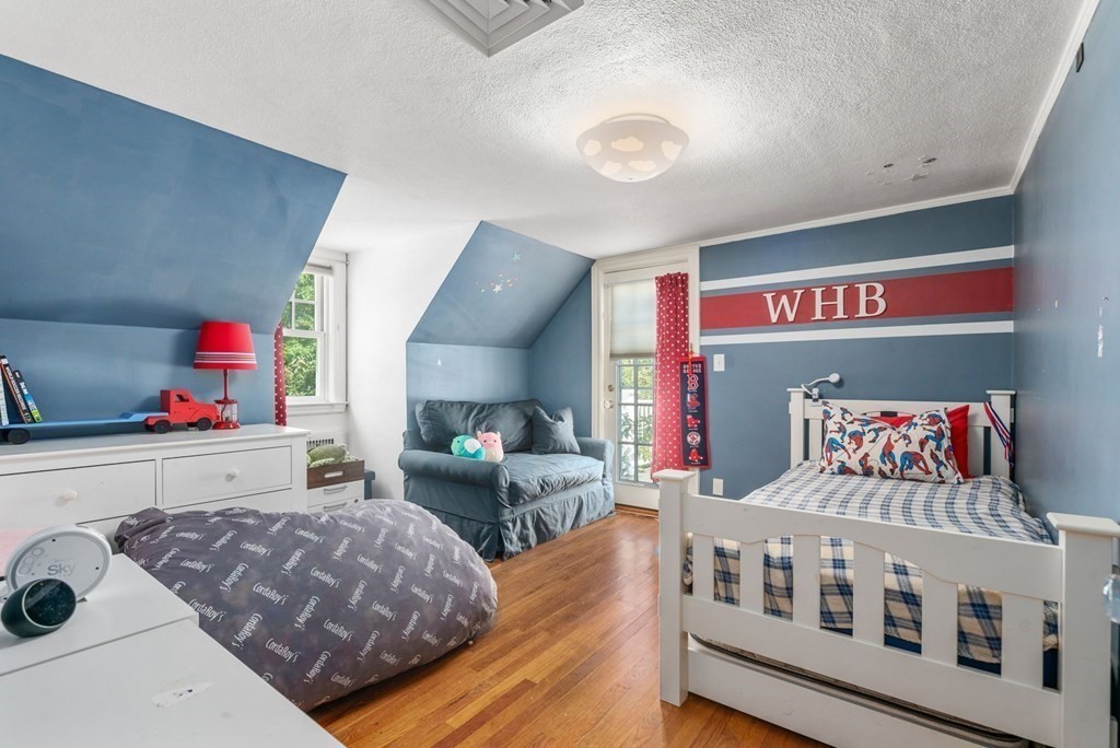 32 Verndale Road Newton, MA 02461 - Photo 18 of 33 a bedroom with furniture and a baby crib